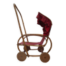 Very old doll's stroller, made of wood and wicker