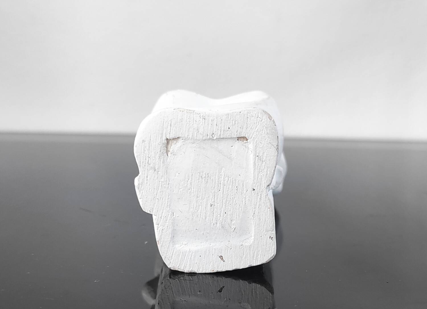 Vintage white plaster statuette of the Virgin Mary.