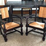 Pair of vintage 1950s Neo-Basque oak armchairs with straw seats and backs.