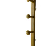 Old yellow wall coat rack
