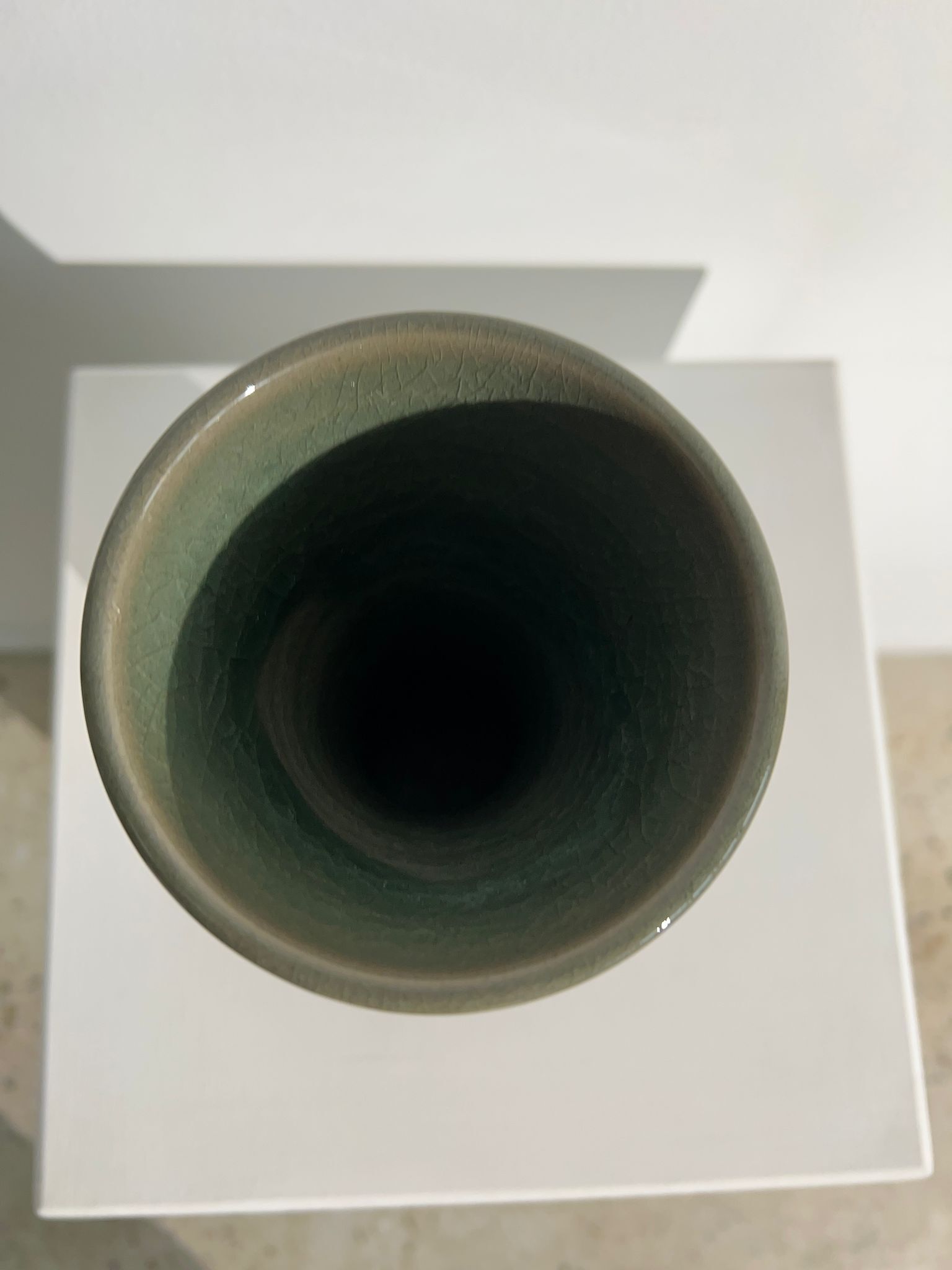 Dark green handcrafted vase with glazed ceramic grass blades