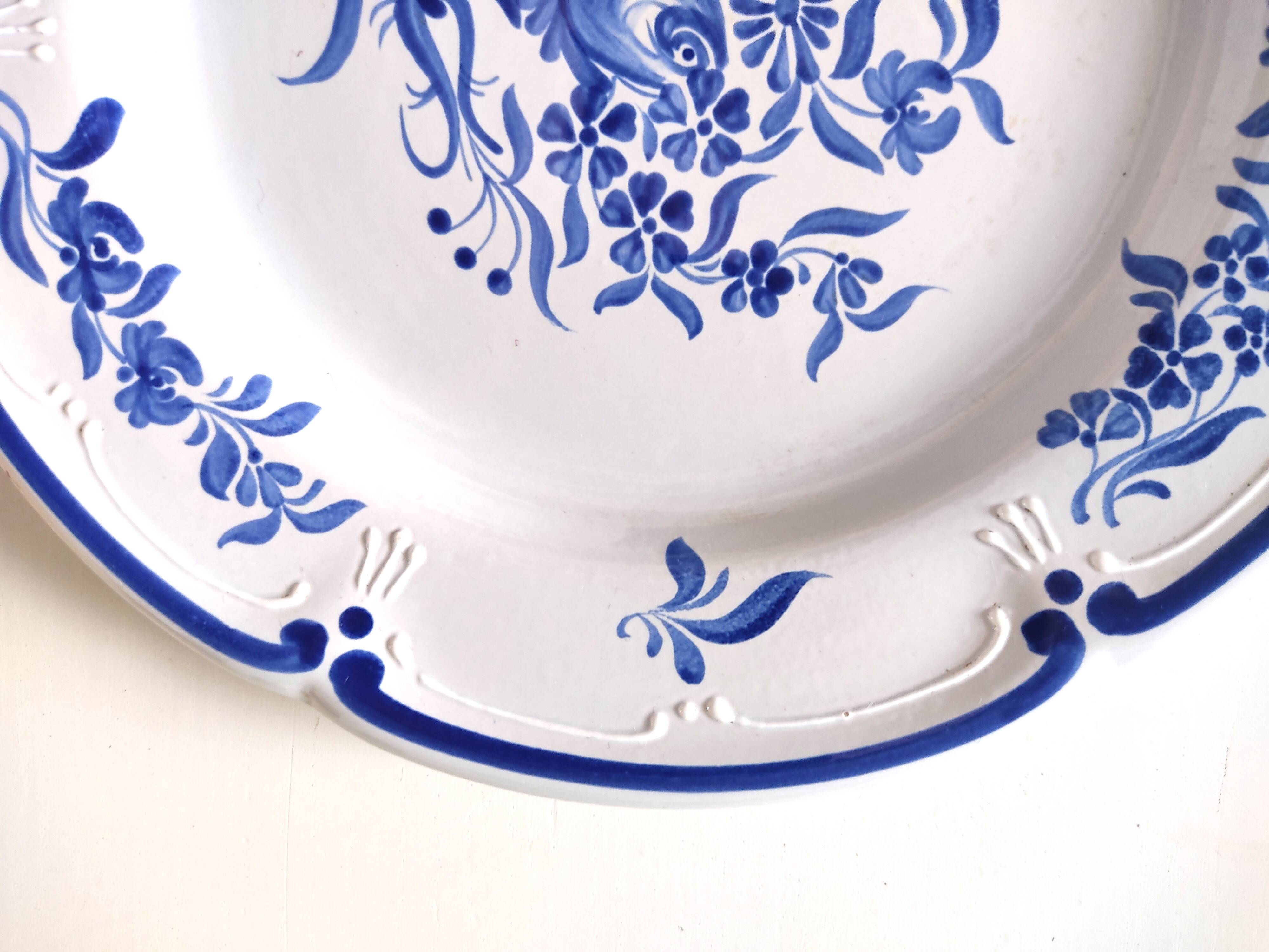 Decorative blue and white earthenware plate
