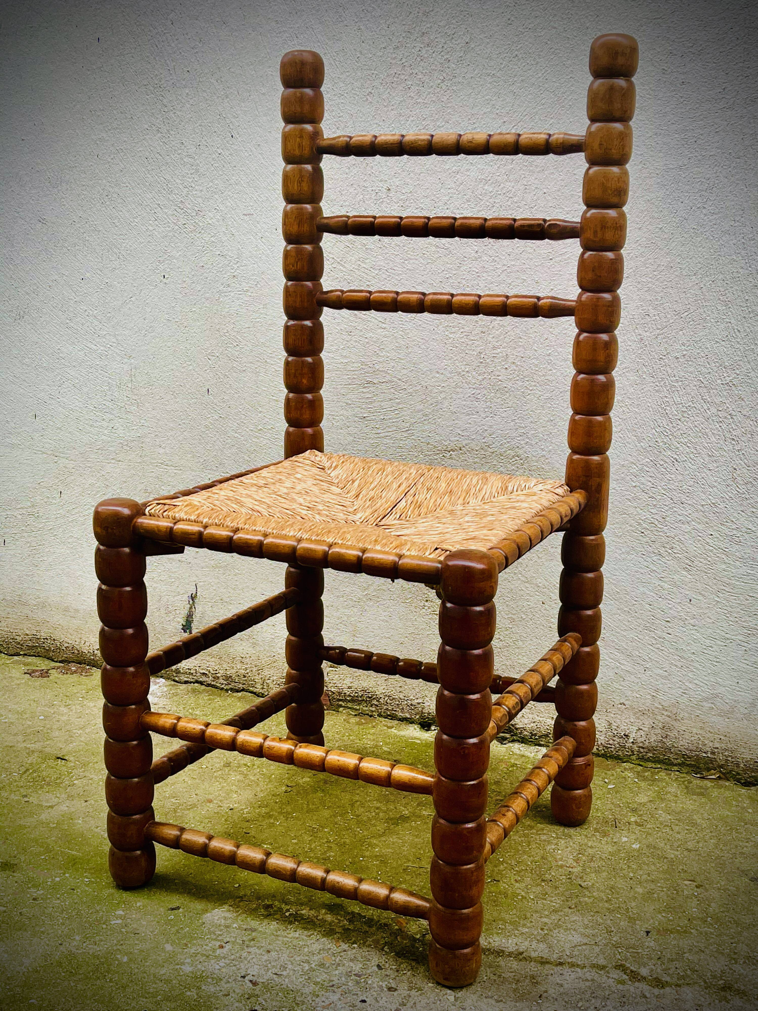Brutalist chairs mulched in turned wood from the 60s