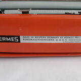 Hermes Baby orange typewriter, portable, functional