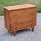 Vintage chest of drawers in golden oak from the 50s with 3 drawers and spindle-legged shelf
