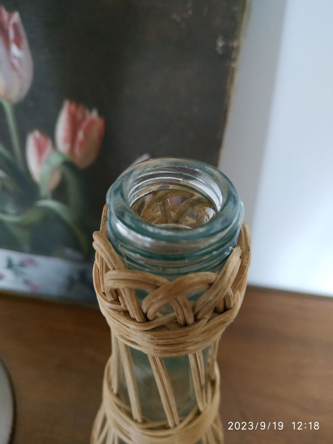 Glass and rattan bottle