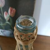 Glass and rattan bottle
