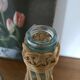 Bouteille en verre et rotin