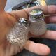 Vintage glass and chrome salt and pepper shaker set.