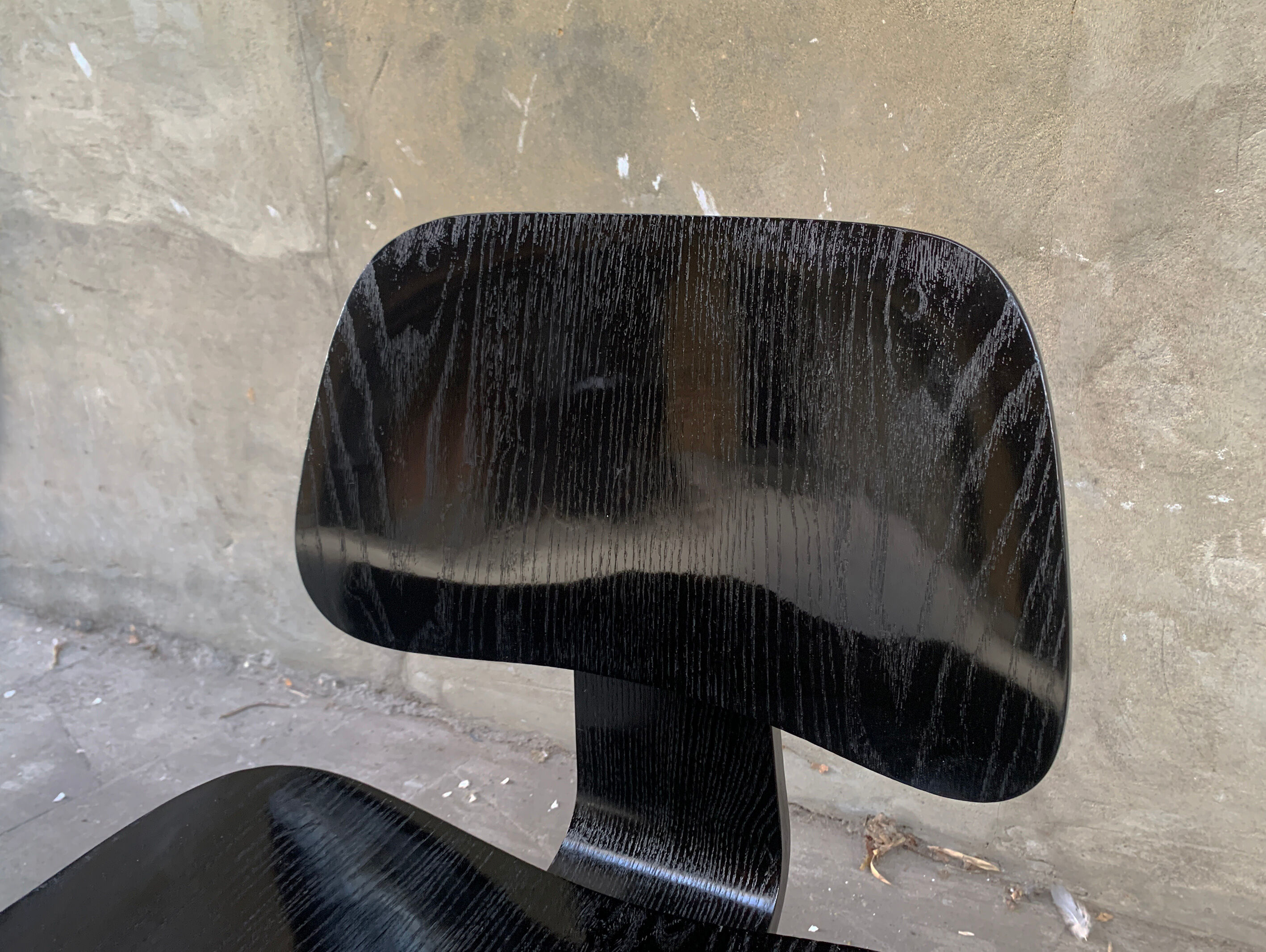 Pair of DCW chairs by Charles & Ray Eames in Black for Herman Miller 1950