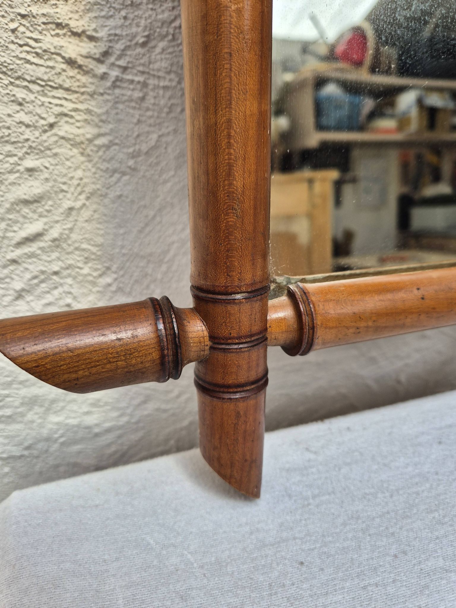 Vintage wooden mirror imitating bamboo