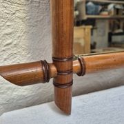 Vintage wooden mirror imitating bamboo