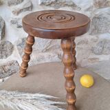 Wooden tripod stool with spool foot