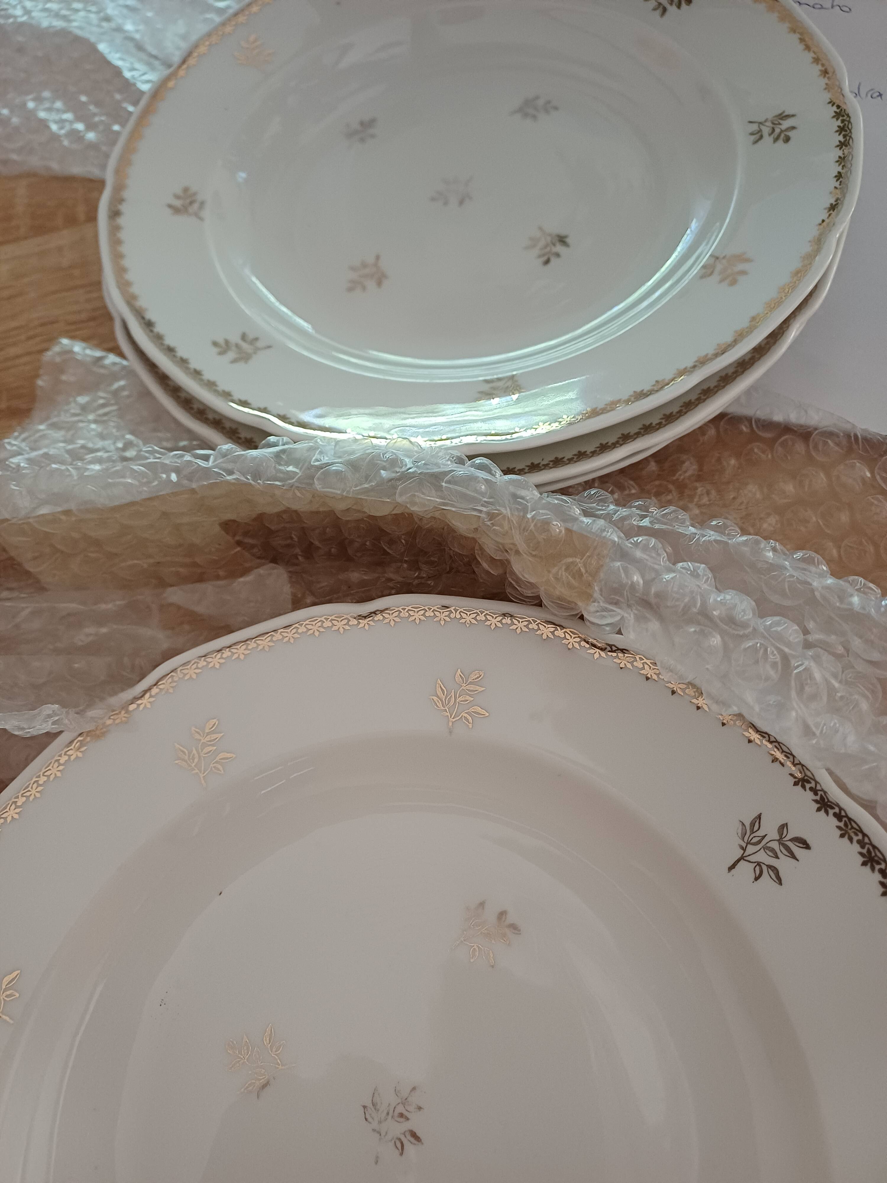 A lot of old white and gold porcelain plates T de F.