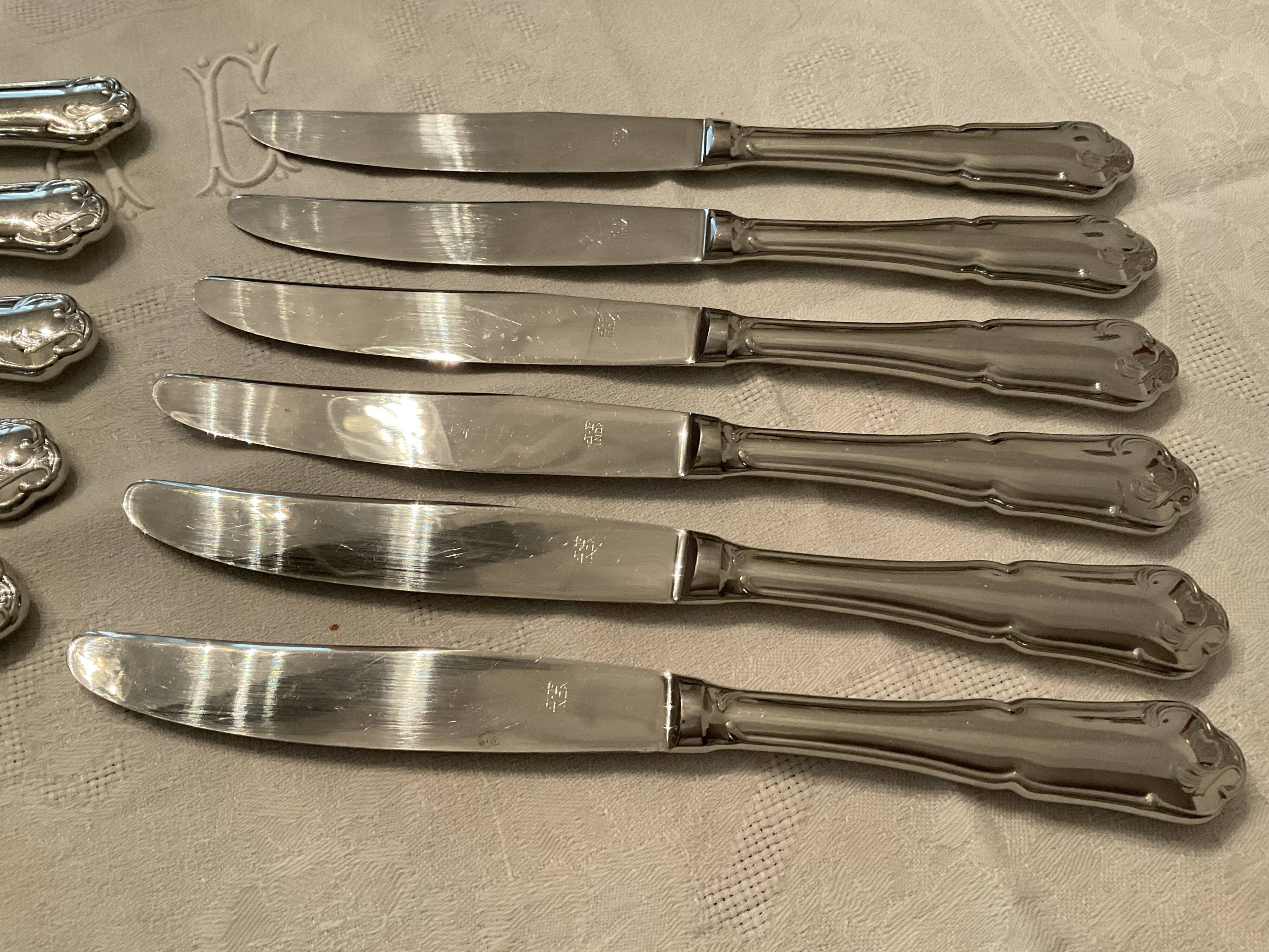 12 stainless steel knives. vintage