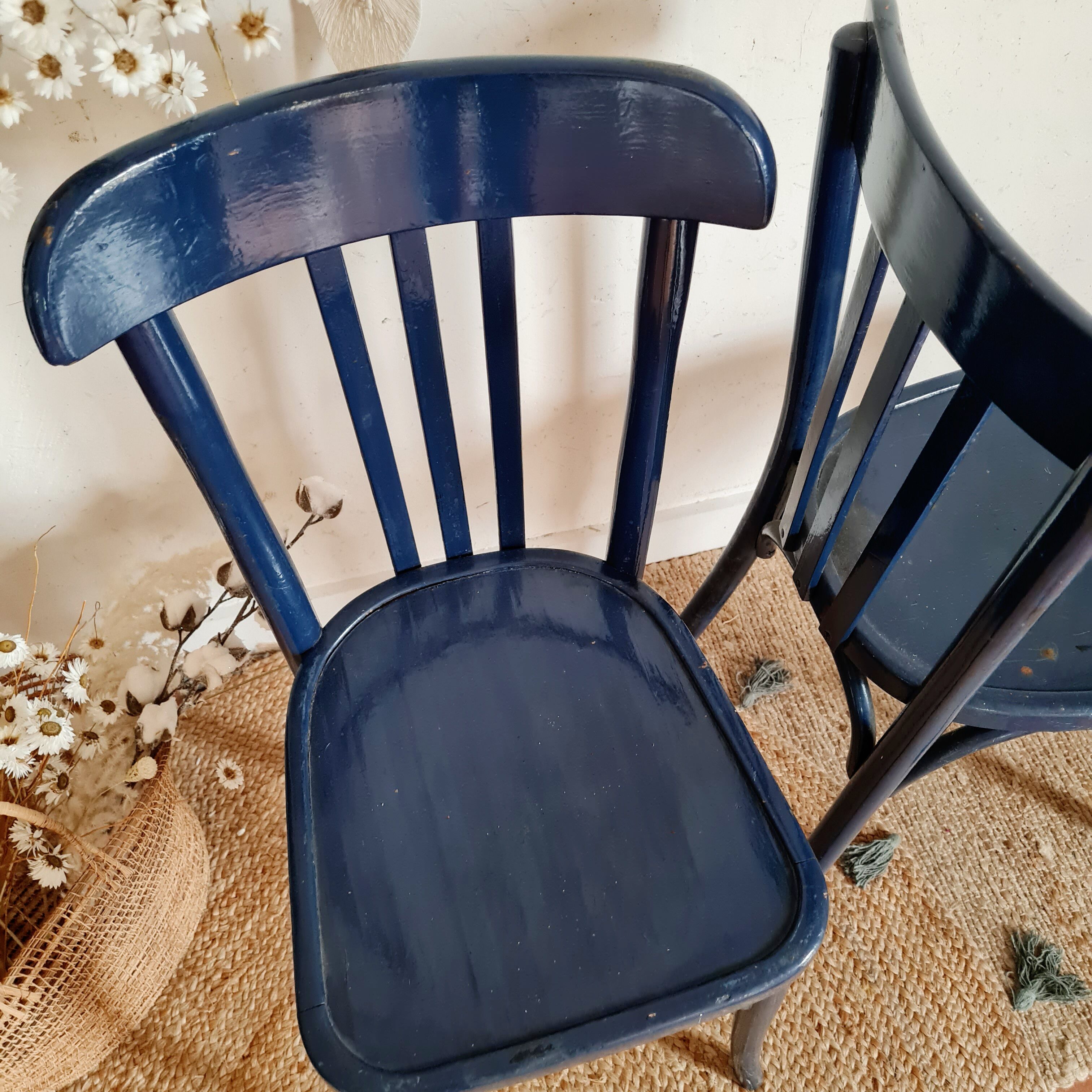 Duo of old blue bistro chairs