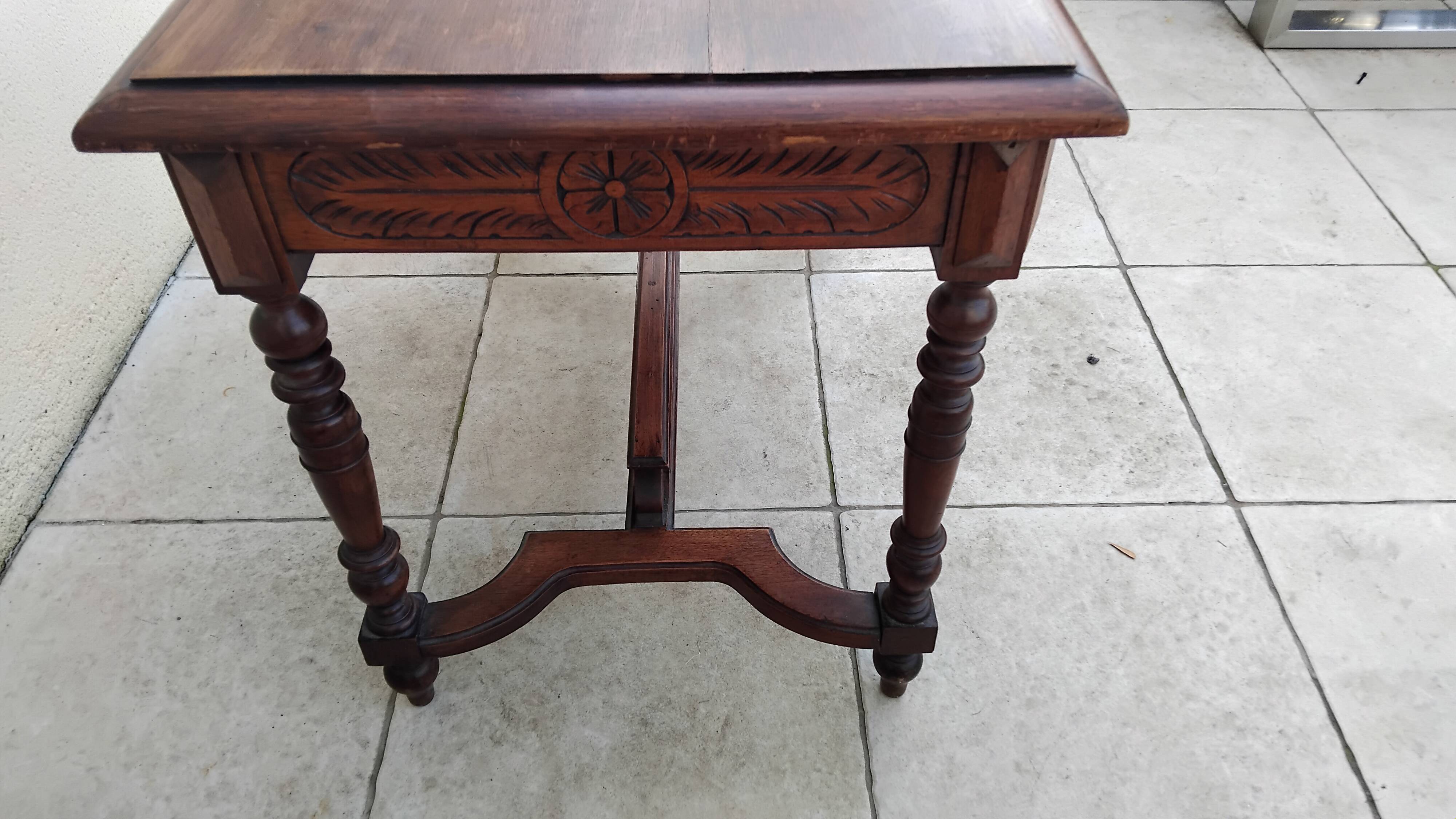 Antique desk or small table in solid carved wood