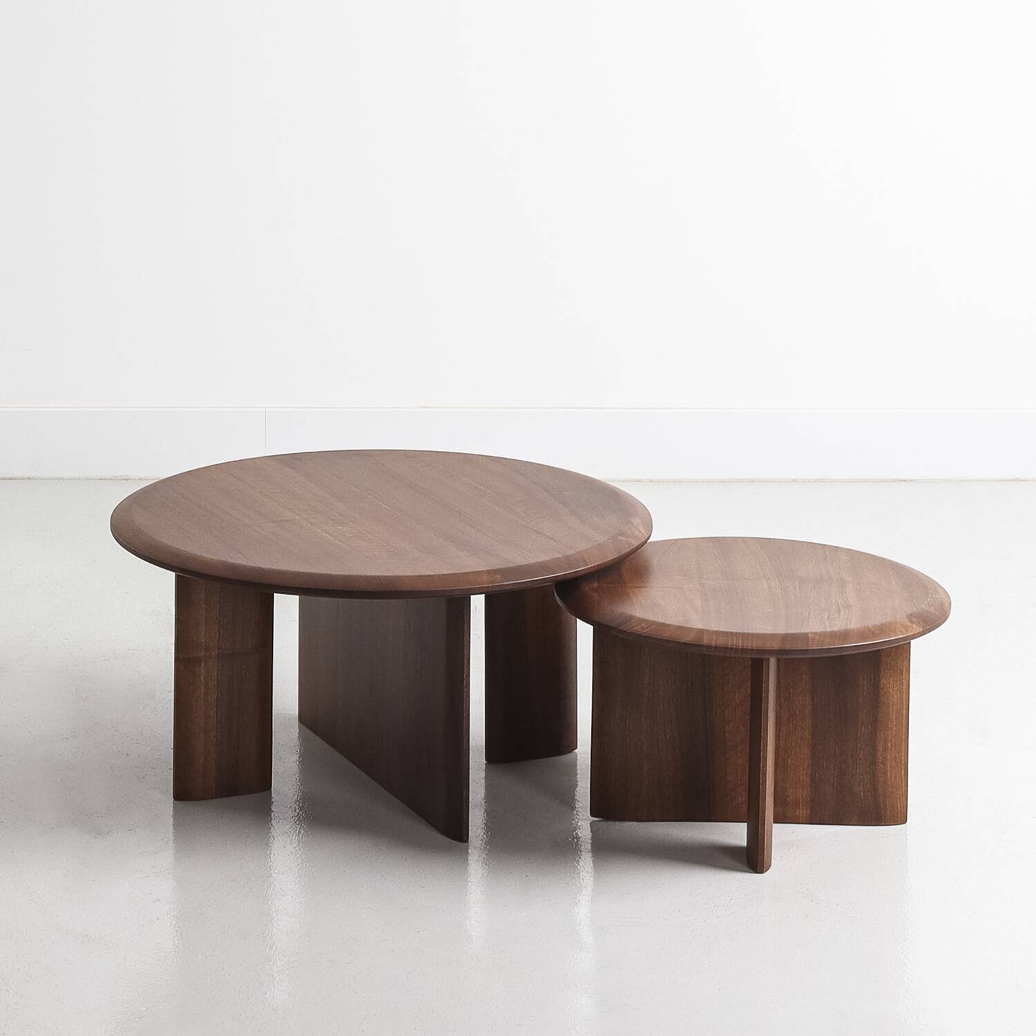 Duo of solid walnut coffee tables with a contemporary design base
