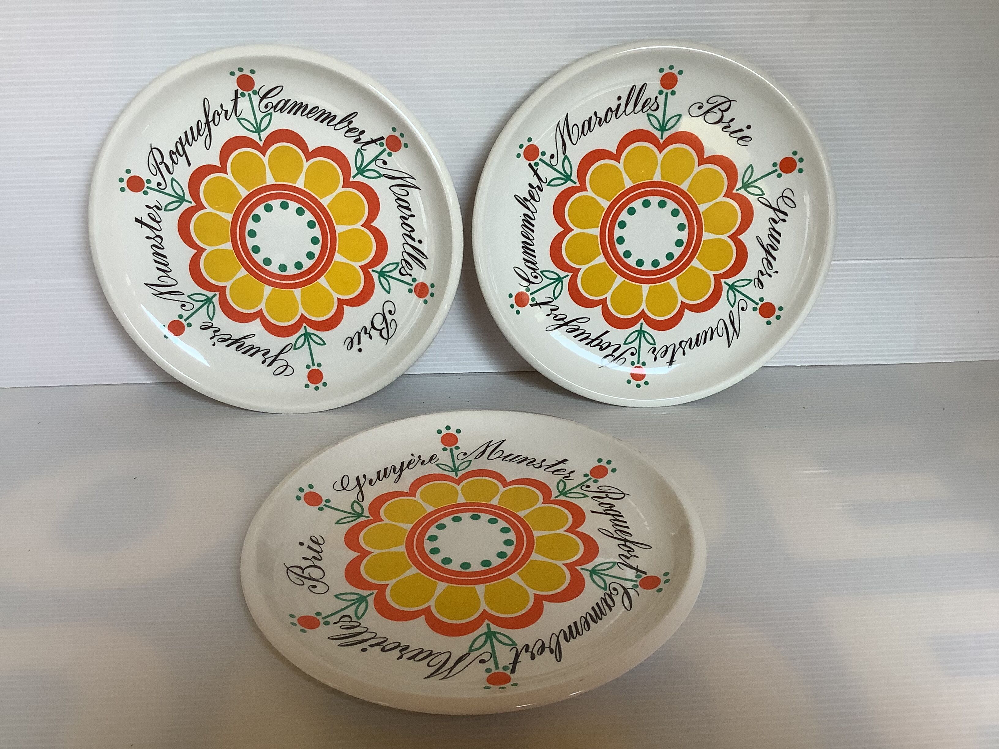 Six vintage floral cheese plates.