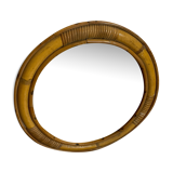 Old rattan mirror with porthole shape