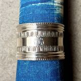 Monogrammed silver napkin ring with palmette and beaded motifs