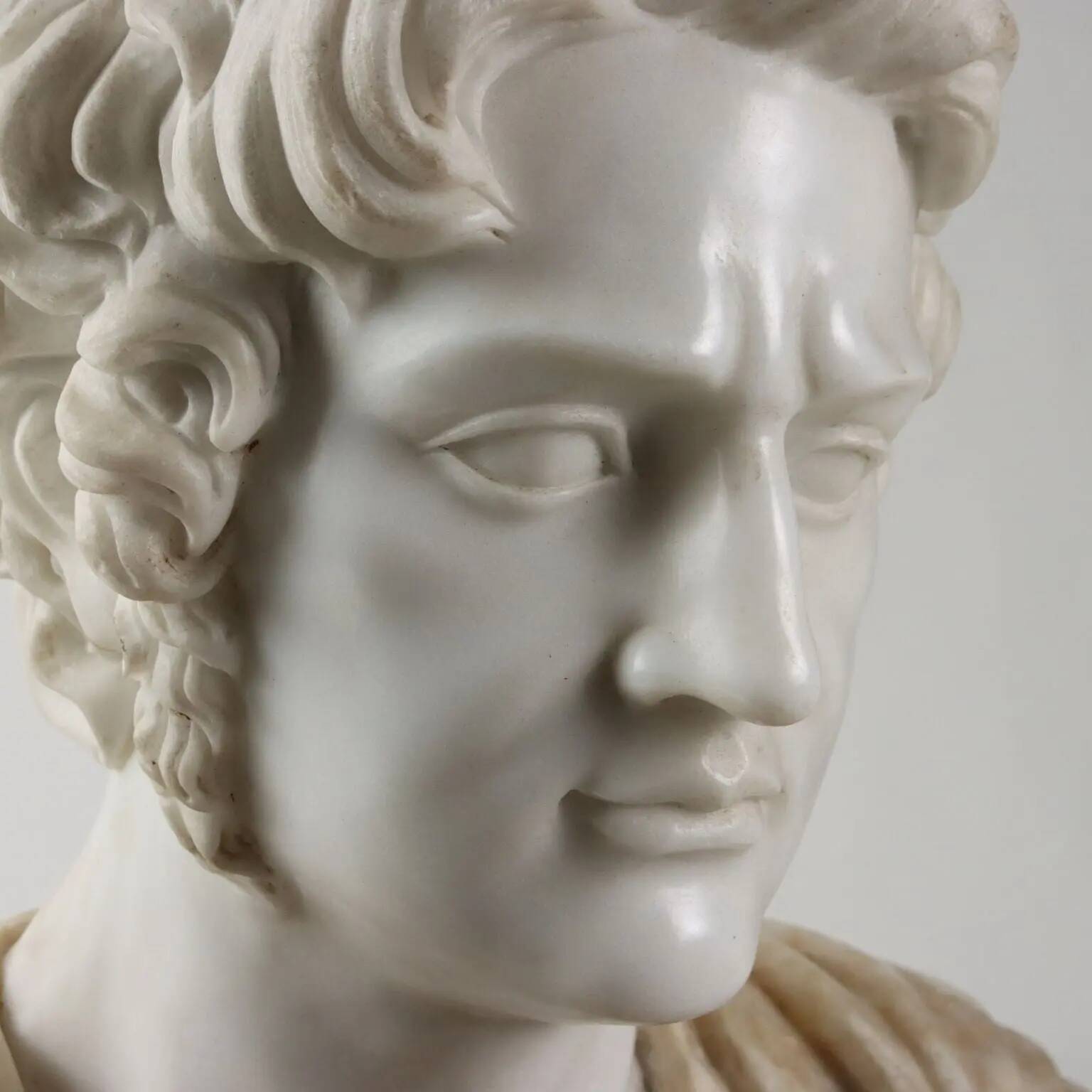 Bust of a Roman emperor in white marble, Italy, 20th century.