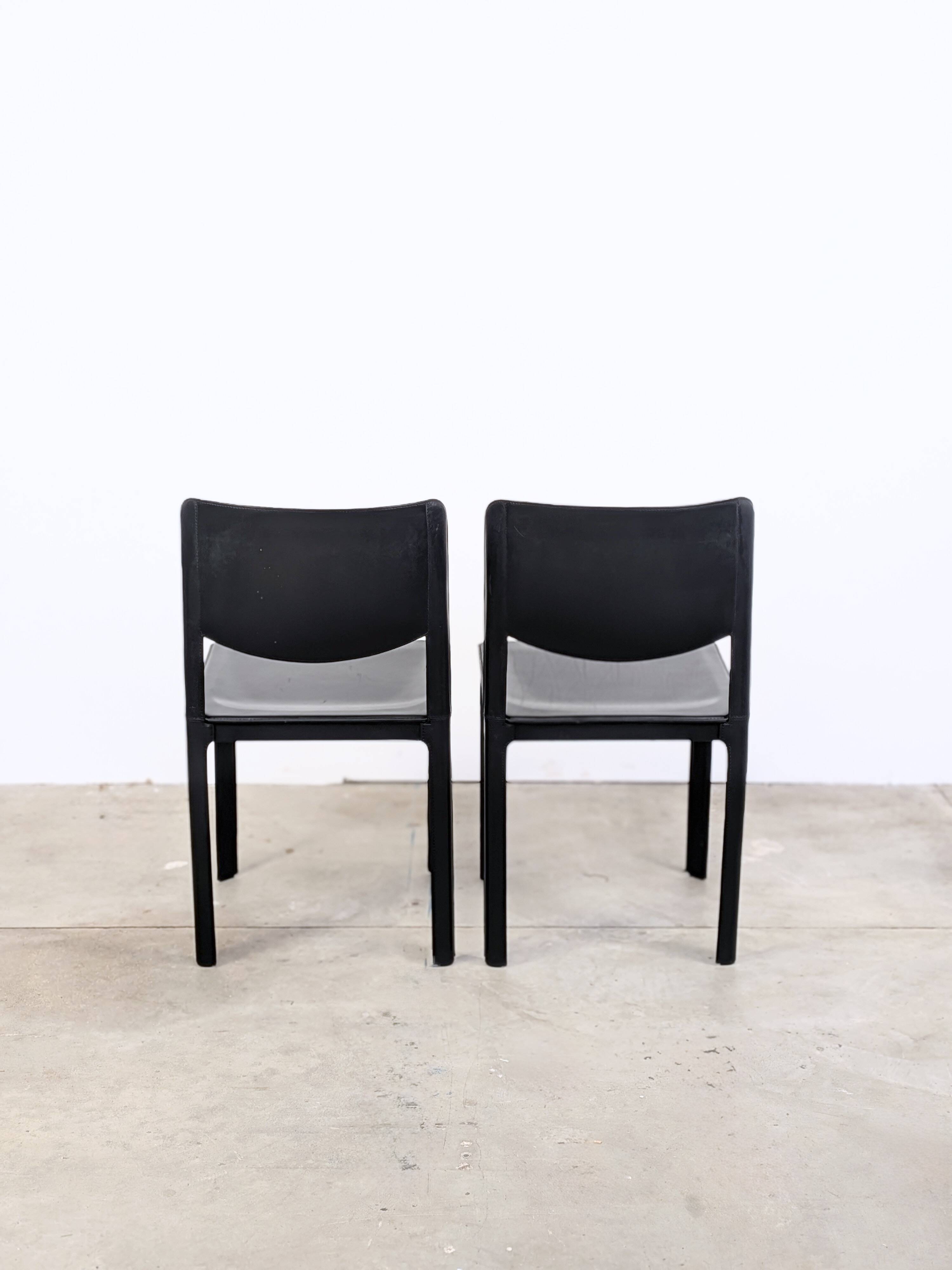 Pair of Matteo Grassi chairs in black saddle leather, 1980s.