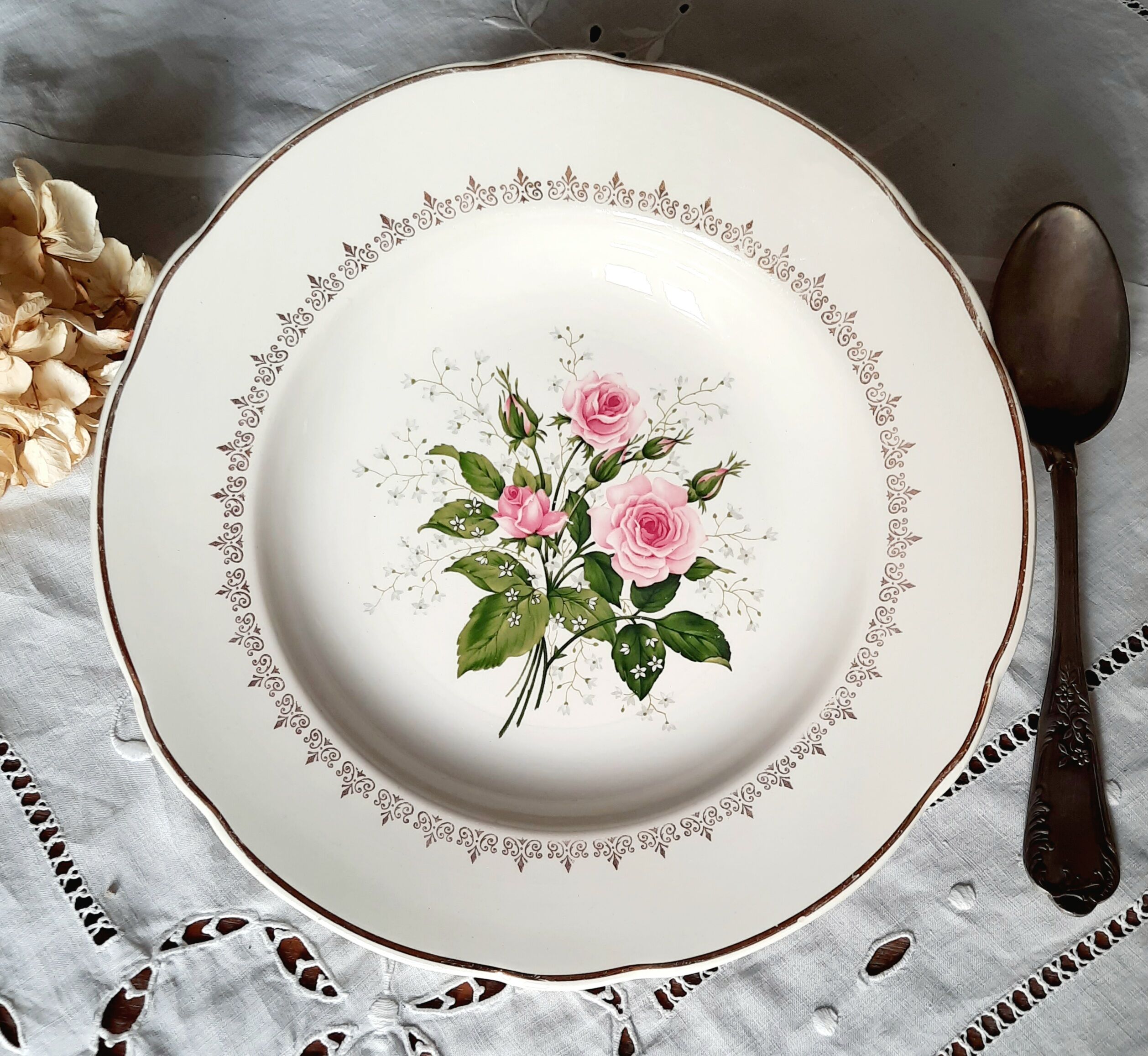 Old hollow plates mismatched in earthenware with gilded edges