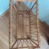 Rattan wicker cradle on wooden wheels