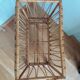 Rattan wicker cradle on wooden wheels