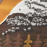 Beautiful wall-mounted Swedish fabric print with motifs of mountains, reindeer and more.