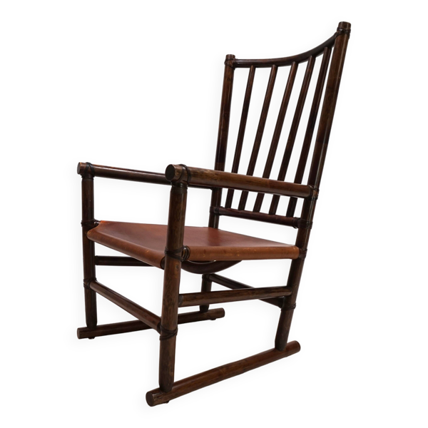Fauteuil Manou en rotin et assise en cuir, 1960