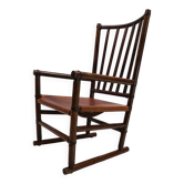 Fauteuil Manou en rotin et assise en cuir, 1960