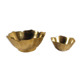 Two brass trundle cups