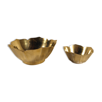 Two brass trundle cups