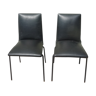 Lot de 2 chaises simili noir par Pierre Guariche