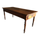Antique Louis Philippe style farm table in solid cherry wood with turned base.