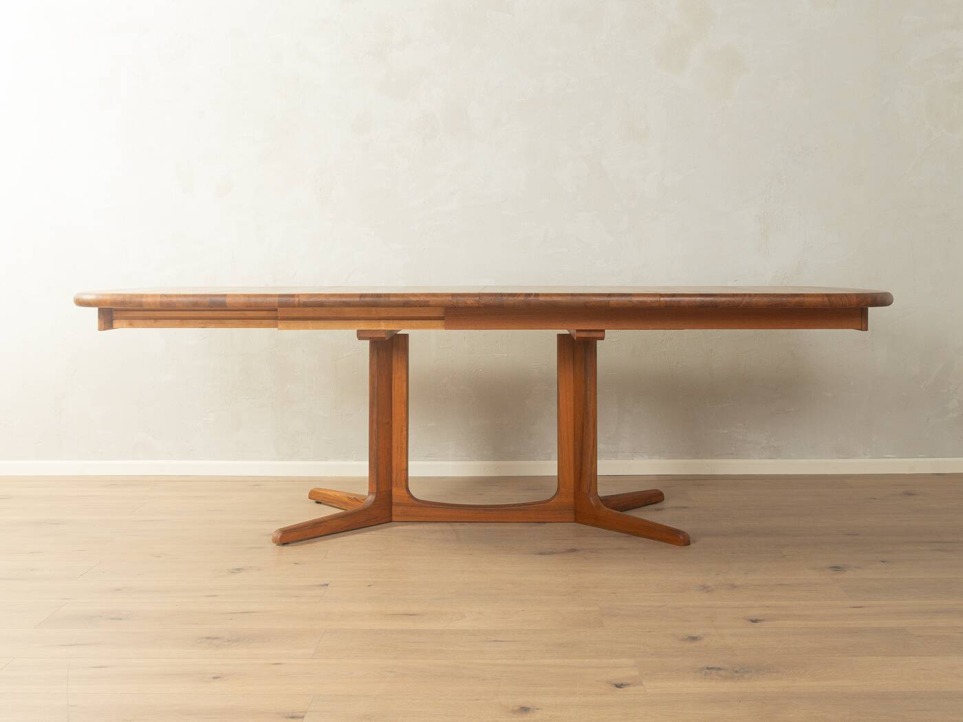 Glostrup dining table, 1980s, solid teak, by Johs. Kristoffersen & Søn, with two extension leaves