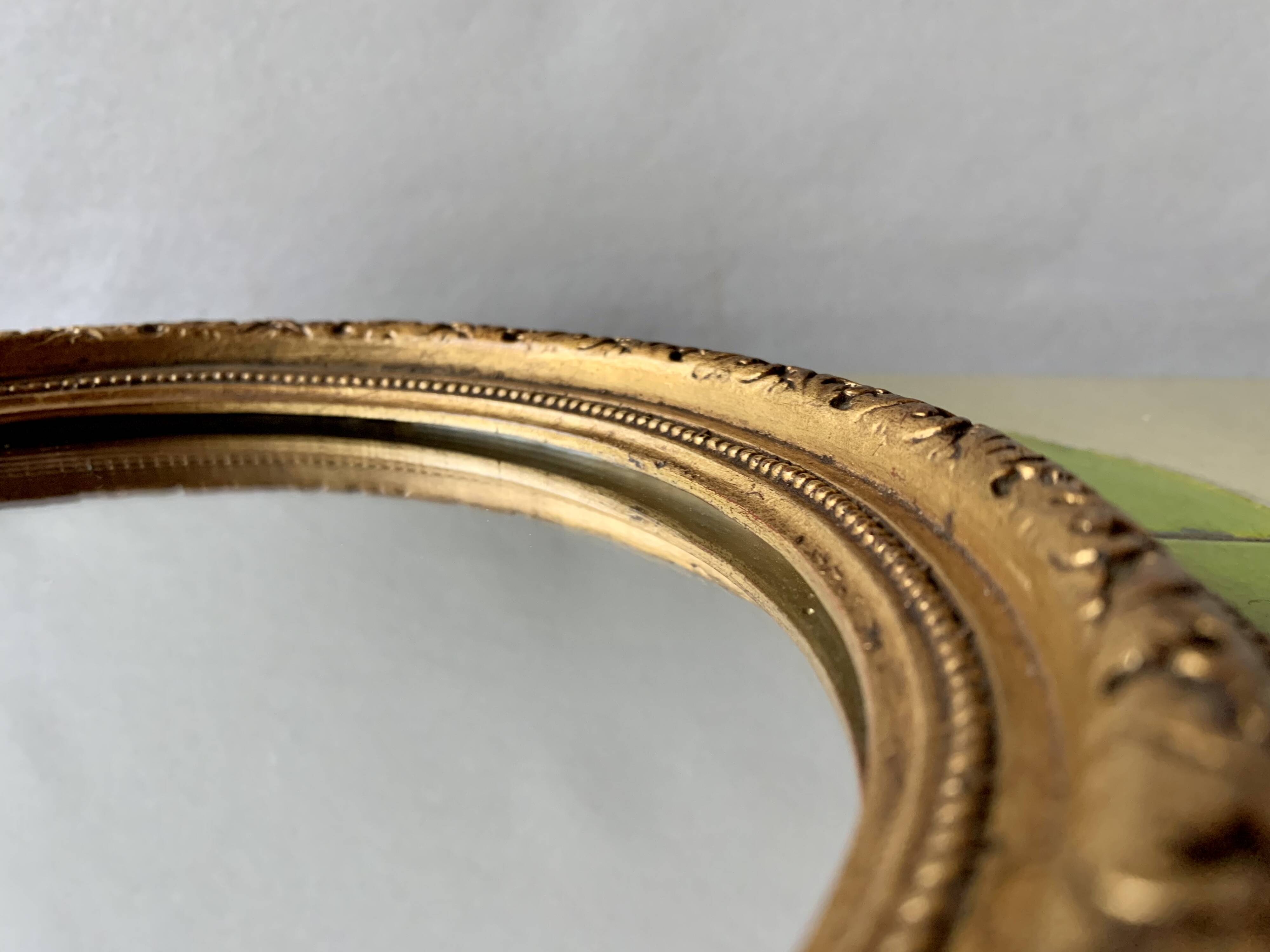 Small vintage wall mirror in gold painted wood