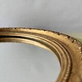 Small vintage wall mirror in gold painted wood