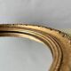 Small vintage wall mirror in gold painted wood