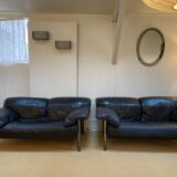 Pair of black leather sofas produced by Poltrona Frau, circa 1980/1990.