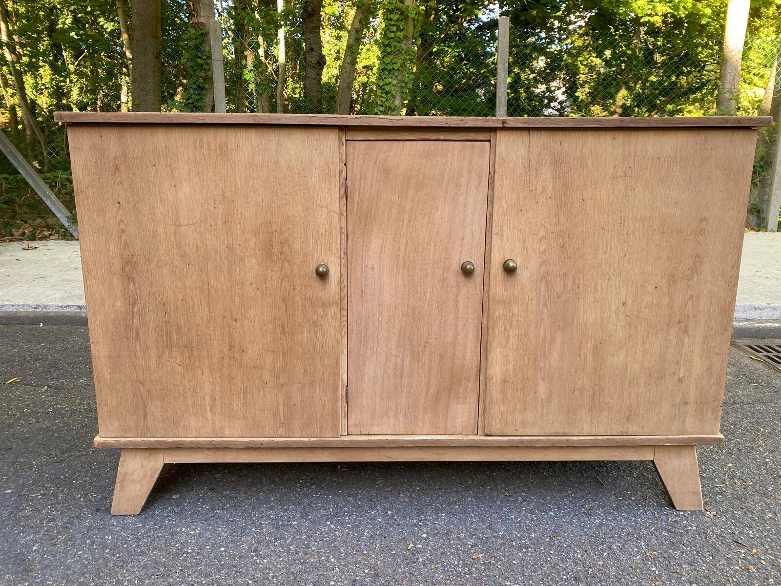 Vintage 1950s oak enfilade buffet with tapered legs.