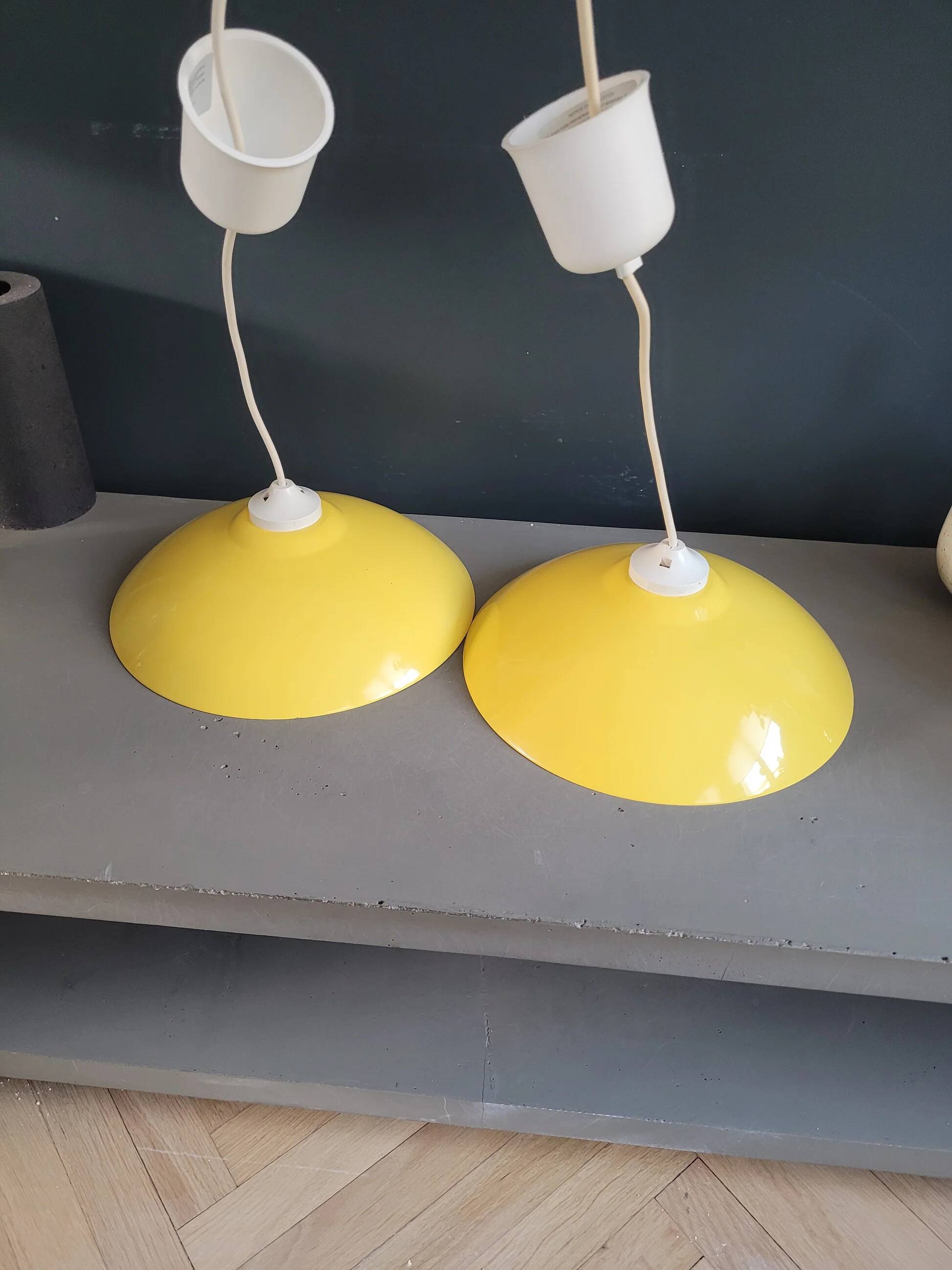 Pair of yellow lacquered metal pendant lights