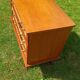 Rattan and wood splayed-leg chest of drawers