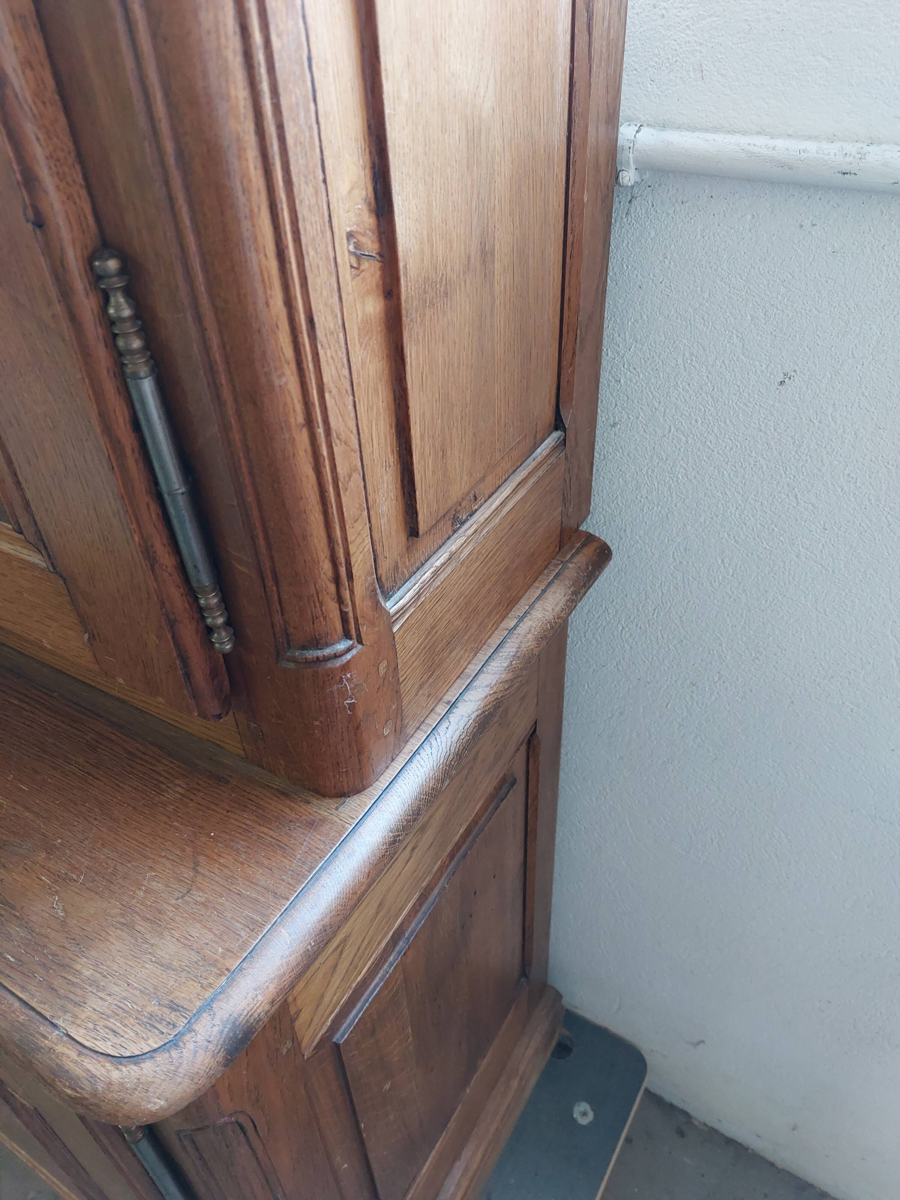 Showcase library with two sections in solid oak.