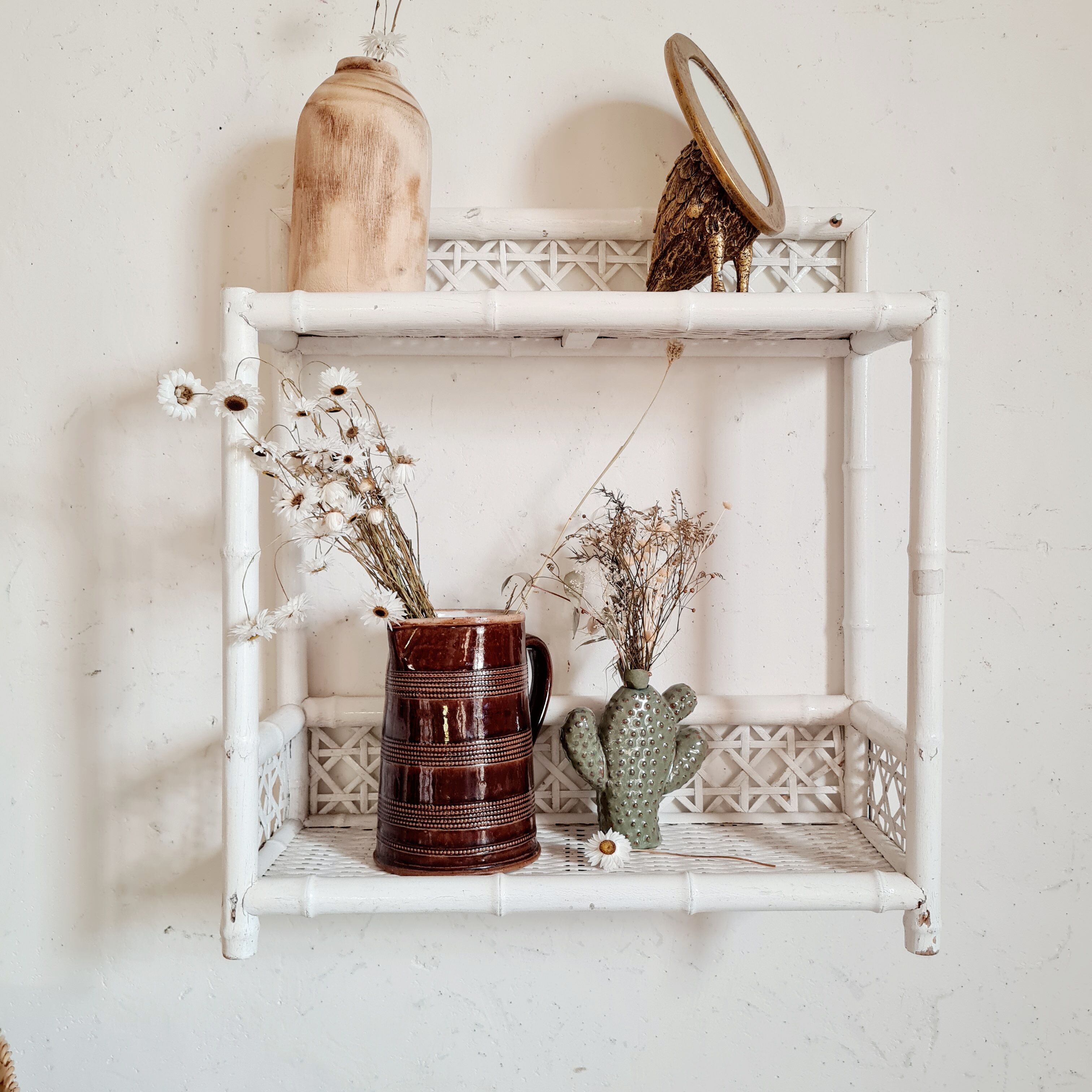 Vintage rattan and bamboo shelves painted white