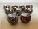 Nine knife holders made from cypraea tigris shells