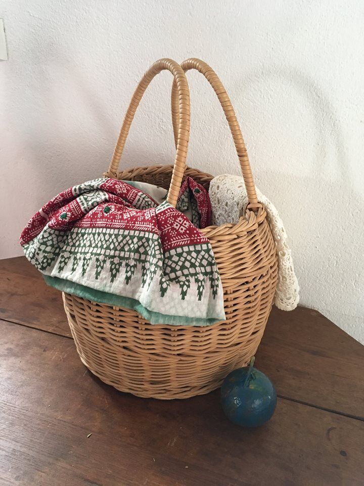 Round basket Wicker braided with two handles.