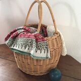 Round basket Wicker braided with two handles.